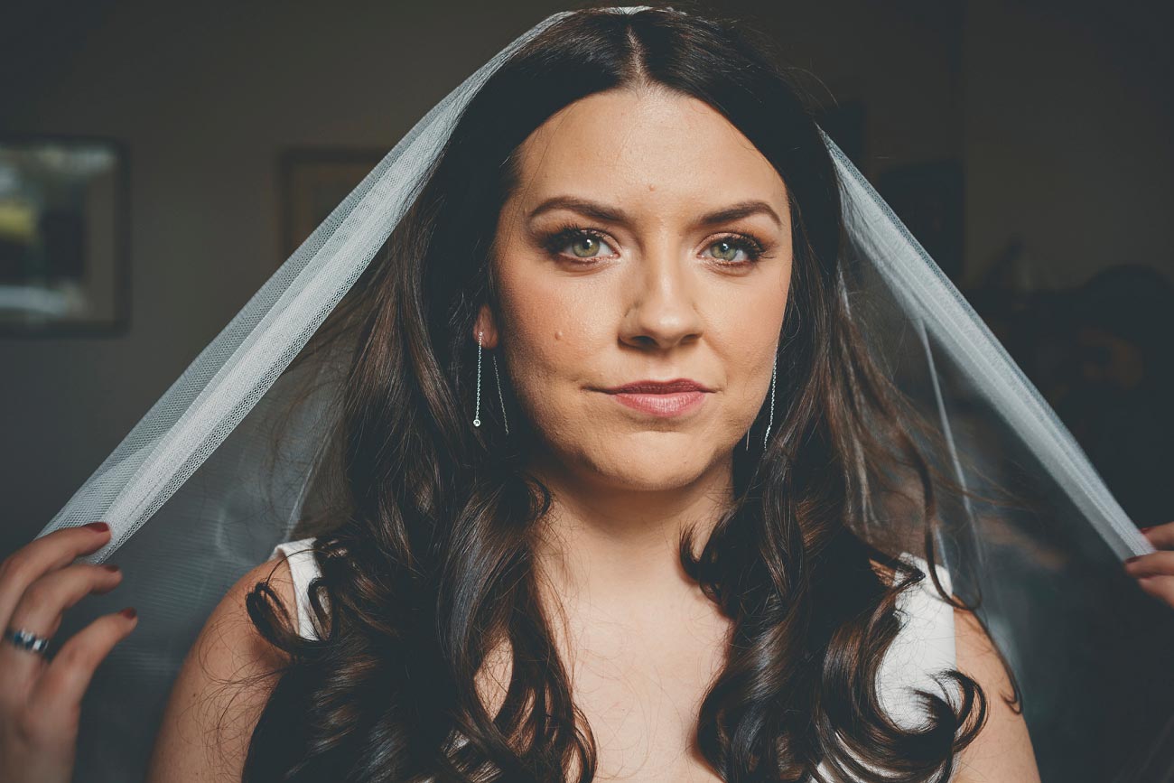 bride with long wavy hair and veil