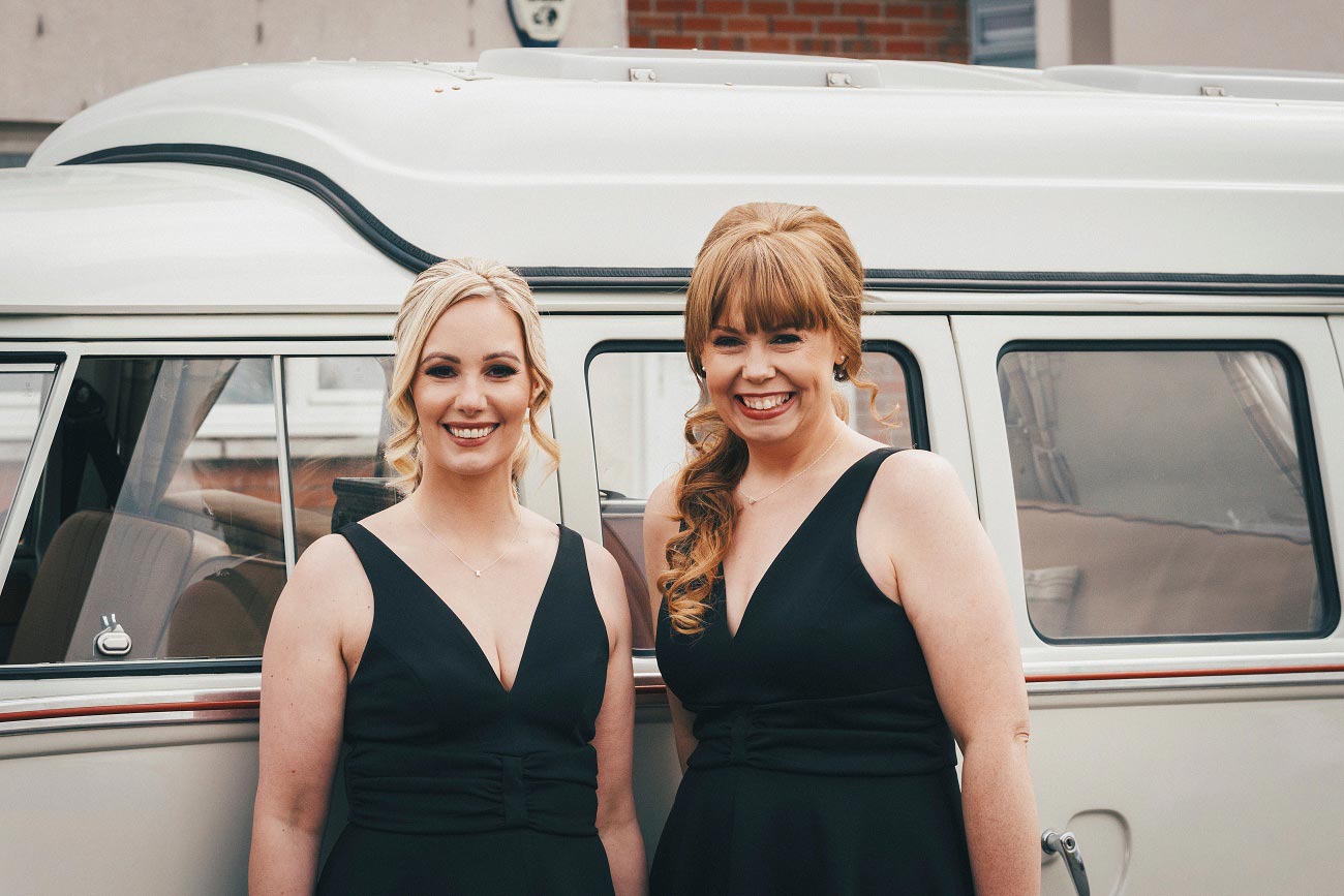 Bridesmaids in black dresses, vintage camper van. Natural Glasgow wedding photography.